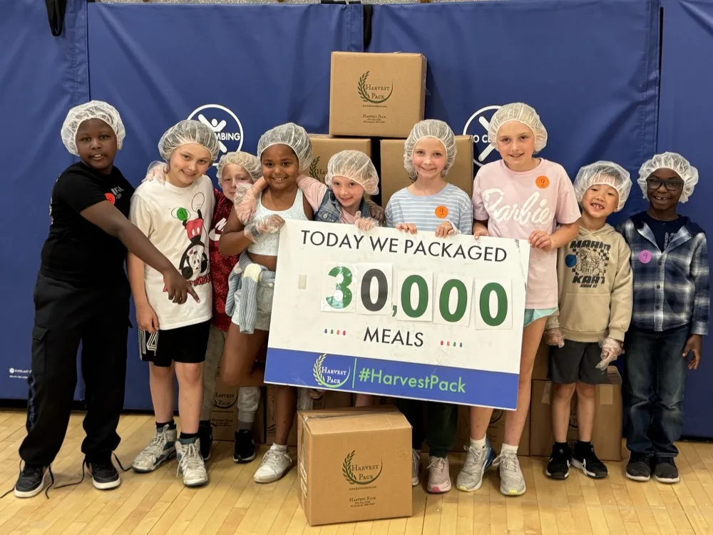 Students celebrating at a school packing event