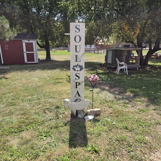 The SoulSpace sign post on the sanctuary lawn