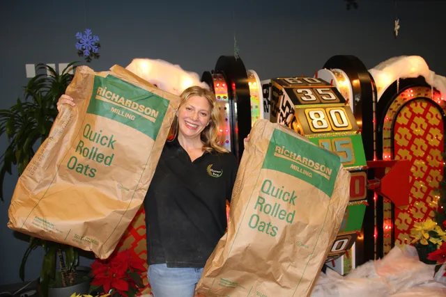 Lauren Siefer holding bags of Harvest Pack oats